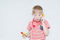 Funny boy playing doctor. Toy syringe, glasses and phonendoscope. Portrait Royalty Free Stock Photo