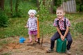 Funny boy with shovel in garden Royalty Free Stock Photo