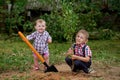 Funny boy with shovel in garden Royalty Free Stock Photo