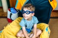 Funny boy smiling sitting inside a suitcase Royalty Free Stock Photo