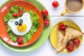 Funny Breakfast with bear-shaped fried egg, toast, cherry tomato Royalty Free Stock Photo