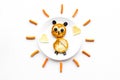 Funny breakfast for children. Meal with cheesecake in shape of owl. White background top view Royalty Free Stock Photo