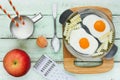 Funny breakfast idea - deceptive fried eggs and french fries fro Royalty Free Stock Photo