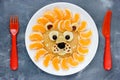 Funny breakfast idea lion pancake with tangerines