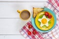 Funny Breakfast with star-shaped fried egg, toast, cherry tomato