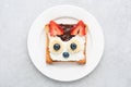 Funny breakfast toast for kids shaped as cute cat