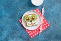 Funny breakfast toast for kids shaped as cute dog. Food art sandwich for child. Isolated. Animal faces toasts with spreads, fruits Royalty Free Stock Photo