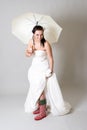 Funny bride with umbrella