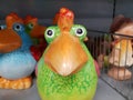 Funny bright ceramic birds for the garden