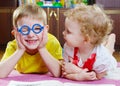 Funny brother in glasses with sister Royalty Free Stock Photo