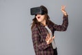 Funny brunette woman testing virtual reality helmet Royalty Free Stock Photo