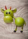 Funny bull made of green apple and kiwi