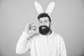 Funny bunny with beard and mustache. Join celebration. Having fun. Grinning bearded man wear silly bunny ears. Easter