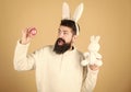 Funny bunny man soft ears. Easter activities concept. Weirdo concept. Celebrate Easter. Guy bearded hipster weird bunny