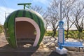 Funny bus stop shaped as a watermelon fruit on the famous Tokimeki Fruit-shaped Bus Stop Avenue in Kyushu.