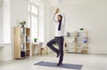 Funny business man with necktie around head relaxing and doing yoga at work in office Royalty Free Stock Photo