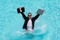 Funny business man relaxing in suit on swimming pool. Summer vacation, business on sea beach. Summer rest, business Royalty Free Stock Photo