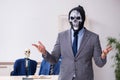 Funny business meeting with devil and skeletons Royalty Free Stock Photo