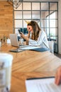 Funny business woman with unicorn headband laughing embarrassed