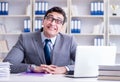 Funny businessman clown acting silly in the office Royalty Free Stock Photo