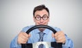 Funny businessman in glasses with a steering wheel Royalty Free Stock Photo