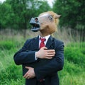 Funny businessman horse on field full of grass