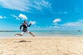 Funny businessman runs from office work on the beach. Summer holiday concept Royalty Free Stock Photo