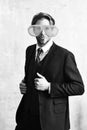 Funny businessman posing with funny orange big party glasses Royalty Free Stock Photo