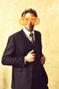 Funny businessman posing with funny orange big party glasses Royalty Free Stock Photo