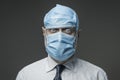 Funny businessman wearing many surgical masks