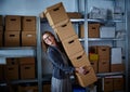 Funny businesswoman holding storage boxes