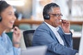 Funny, call center and senior man in office for communication, support and contact us for customer service. Advisory Royalty Free Stock Photo
