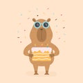 Funny capybara with birthday cake