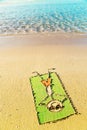 Funny cartoon laying on a towel on the beach