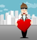 Man dressed for winter hugging big red heart. Royalty Free Stock Photo