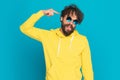 Funny casual man with retro glasses pointing finger to head Royalty Free Stock Photo