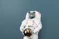 Funny cat astronaut in a space suit with a helmet on a gray background. British cat spaceman. Creative idea. Royalty Free Stock Photo