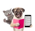 Funny cat and smart puppy with book and smartphone. isolated on white background