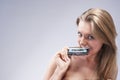 Funny Caucasian Blond Female Playing With Old Audio Cassette