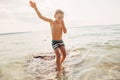 Funny Caucasian boy swimming in lake river with underwater goggles Royalty Free Stock Photo