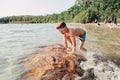 Funny Caucasian boy swimming in lake river with underwater goggles Royalty Free Stock Photo