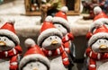 Funny ceramic penguins in Christmas dress, sold at the Christmas market