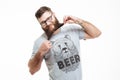 Funny cheerful bearded man standing and having fun