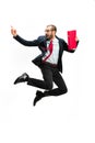 Funny cheerful businessman jumping in air over white background Royalty Free Stock Photo