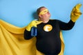 Funny cheerful fat man with detergent in hands Royalty Free Stock Photo