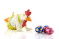 Funny chicken looks to easter eggs
