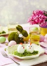 Funny chickens from eggs on the Easter table. Easter table setting Royalty Free Stock Photo