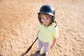 Funny child batter about to hit a pitch during a baseball game. Kid baseball ready to bat. Fun child face. Royalty Free Stock Photo