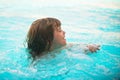 Funny child on beach. Kid swimming in water. Activities on pool. Summer vacation concept. Royalty Free Stock Photo