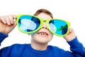 Funny Child in Big Eyeglasses smiling and looking up. Happy Little Boy in Glasses laughing over White Background. Curious